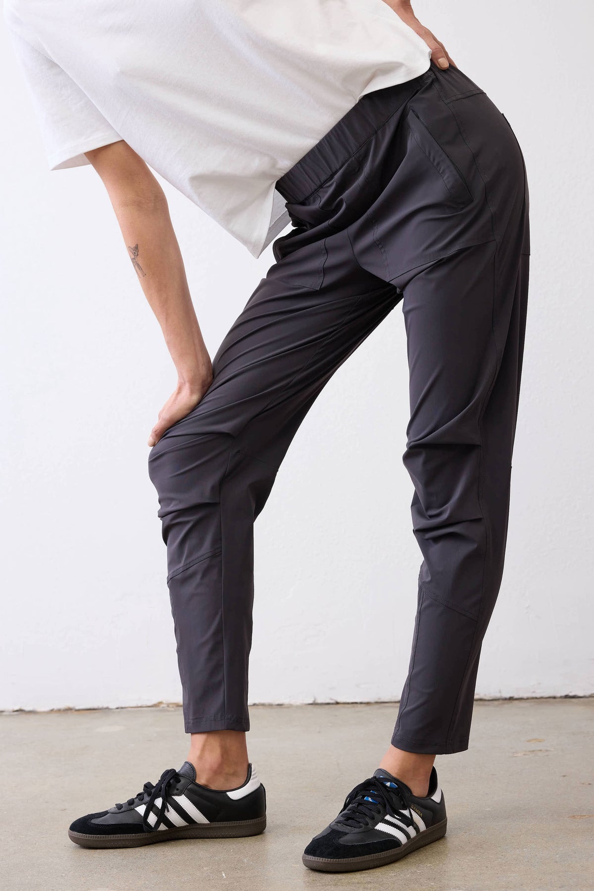 Graphite active pants with side seams and tapered leg at knee