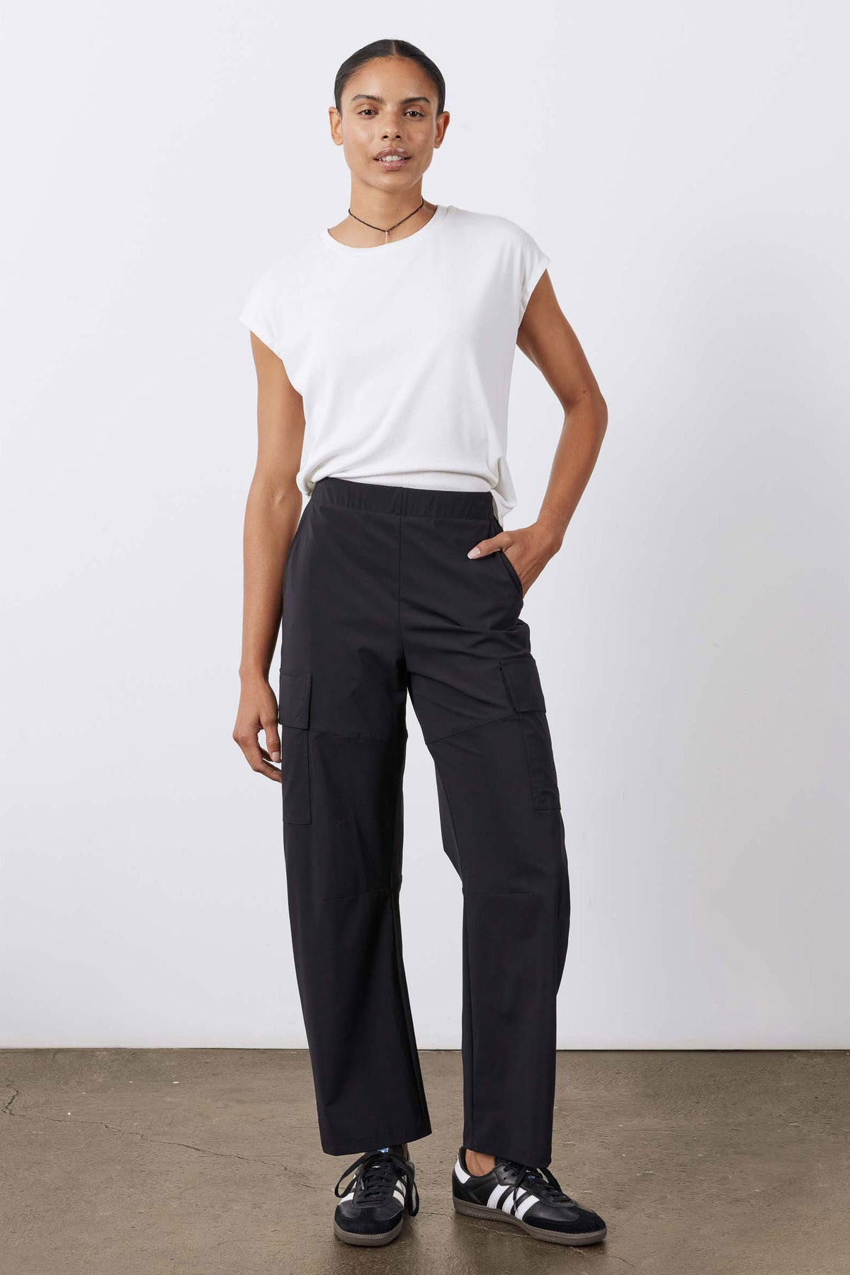 Black utility cargo pants, straight fit with cargo pockets and beltless waistband