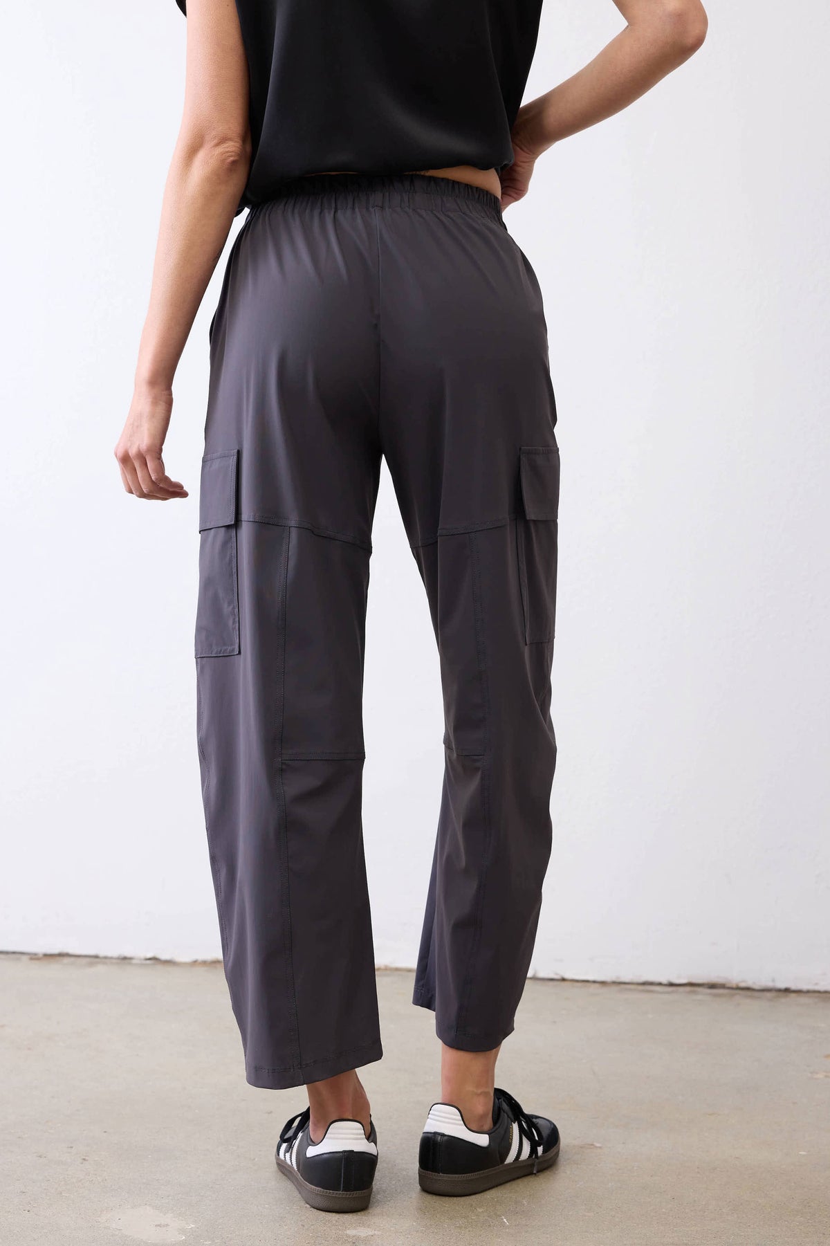 Graphite utility cargo pants with knee seams and side pocket detail on legs