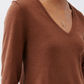Rust-brown V-neck long-sleeve top with short shoulder seam detail
