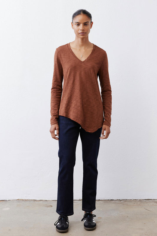 Bark brown v-neck long sleeve top with relaxed fit and curved hemline