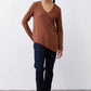 Bark brown v-neck long sleeve top with curved hem and draped relaxed fit