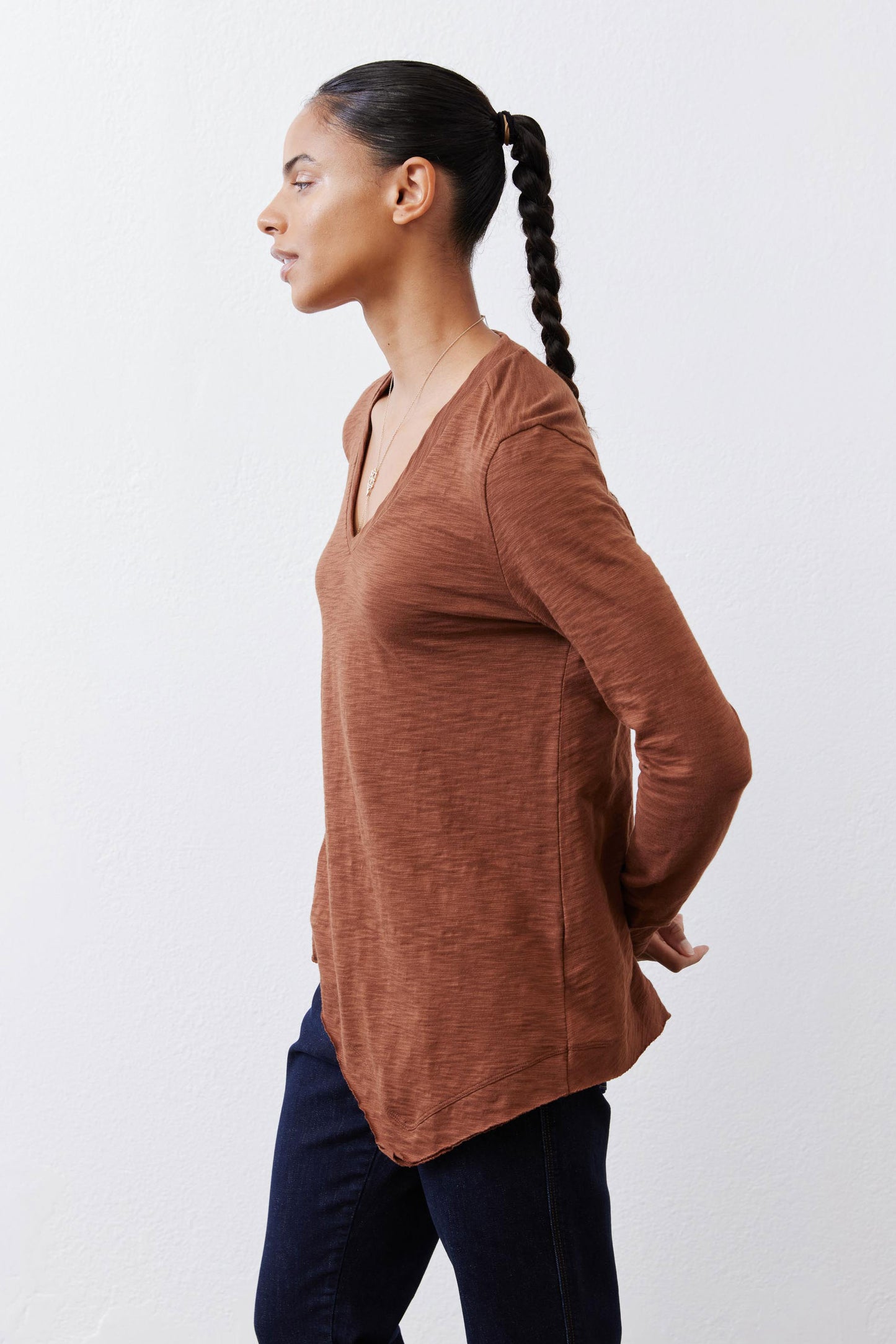 Bark brown v-neck long sleeve top with side profile and curved hemline