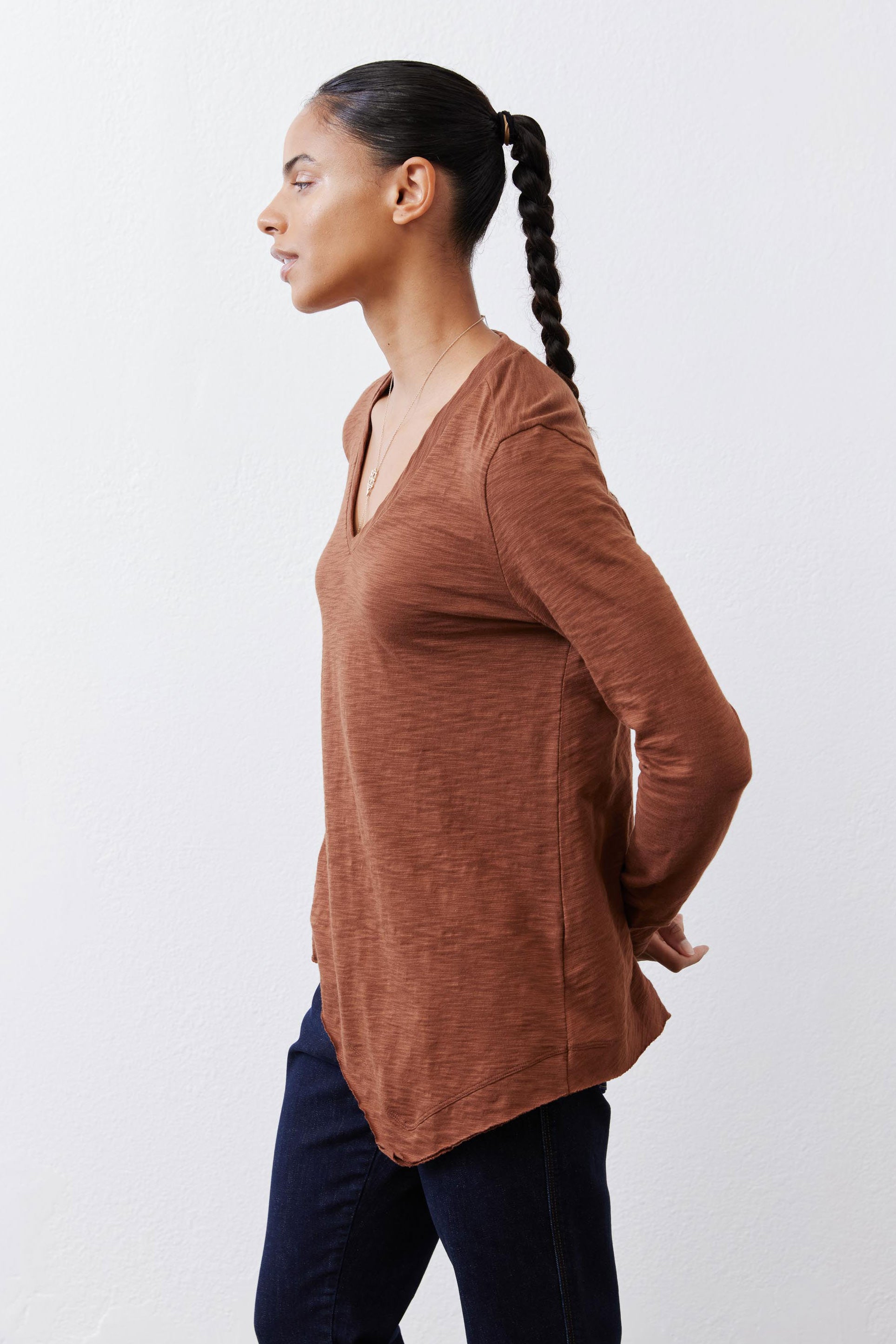 Bark brown v-neck long sleeve top with side profile and curved hemline