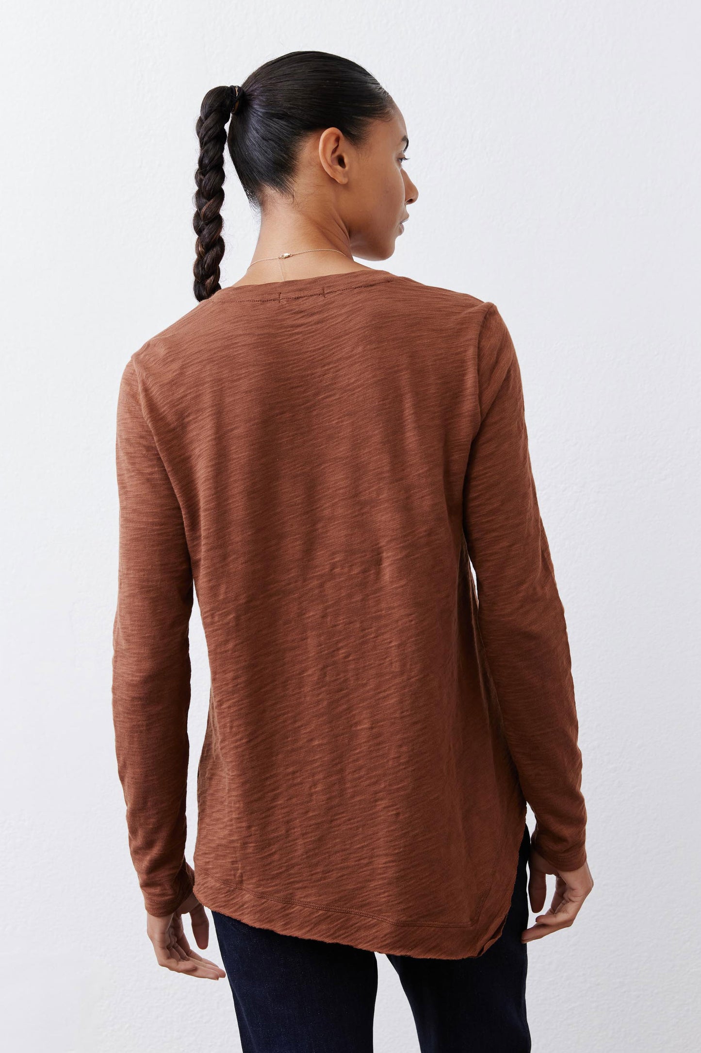 Bark brown long sleeve top, back view with curved hemline