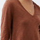 Bark brown v-neck long sleeve top detail with textured fabric and seam lines