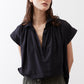 Black oversized blouse with pointed collar and short sleeves, button placket