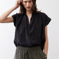 Black voile blouse with short sleeves, split neckline, gathered yoke detail