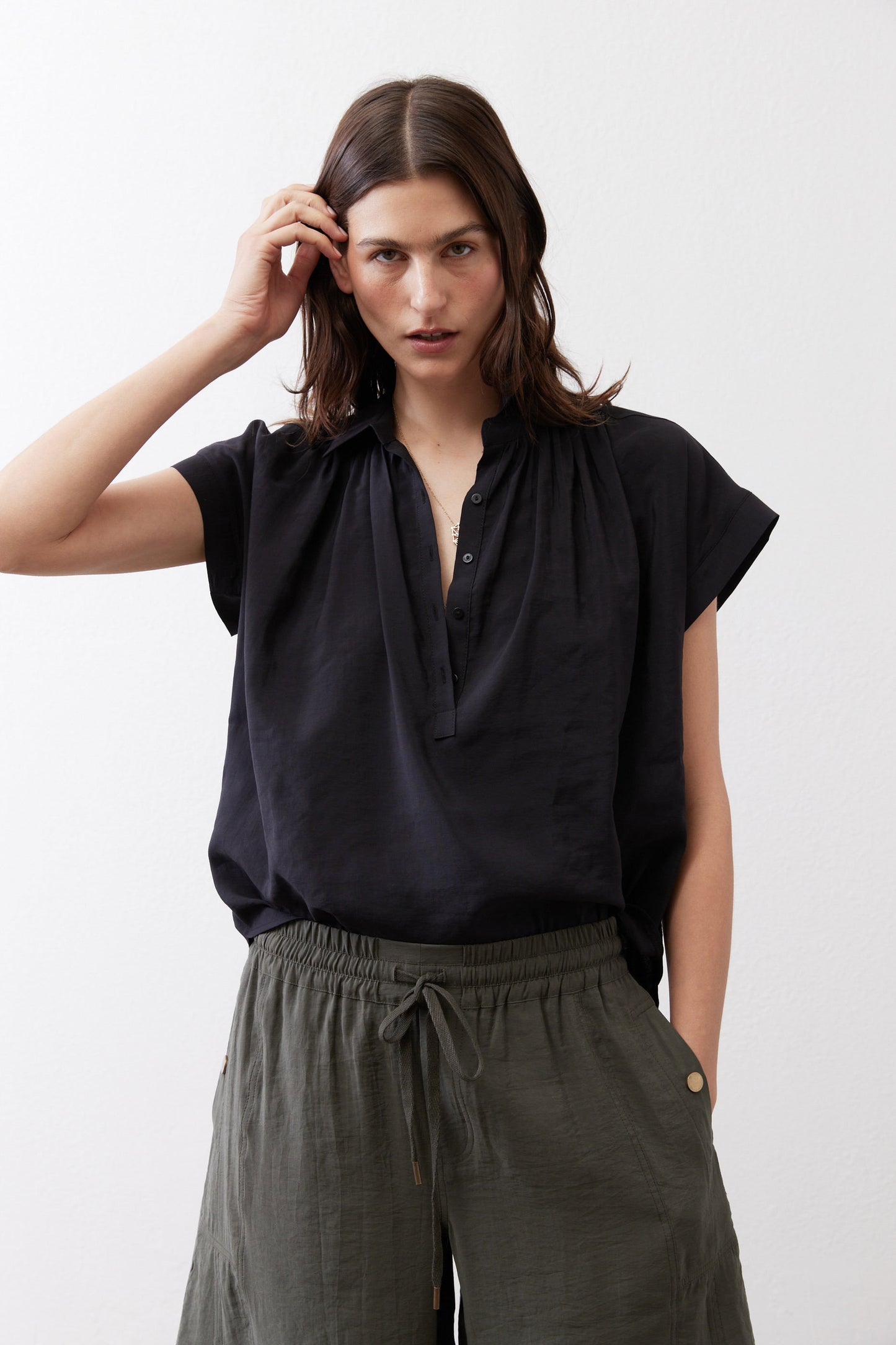 Black voile blouse with short sleeves, split neckline, gathered yoke detail