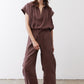 Chicory coffee utility pants with relaxed legs and front button flap pockets