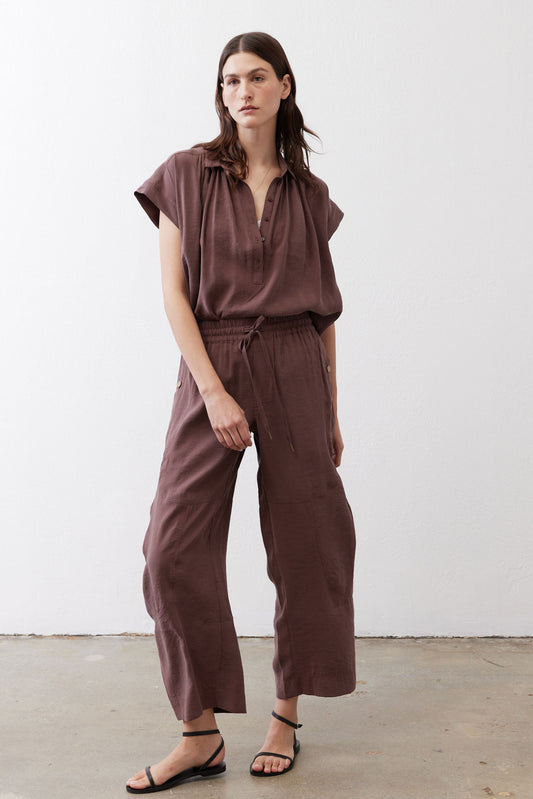 Dark brown baggy utility pants with drawstring elastic waist and relaxed wide legs