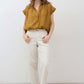 Oversized honey-gold short-sleeve blouse with V-neck and front buttons