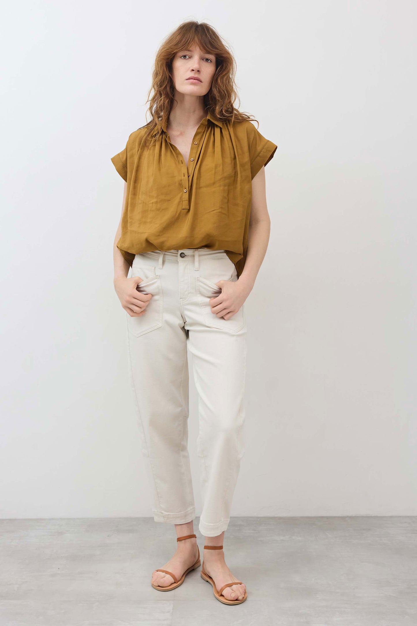 Oversized honey-gold short-sleeve blouse with V-neck and front buttons
