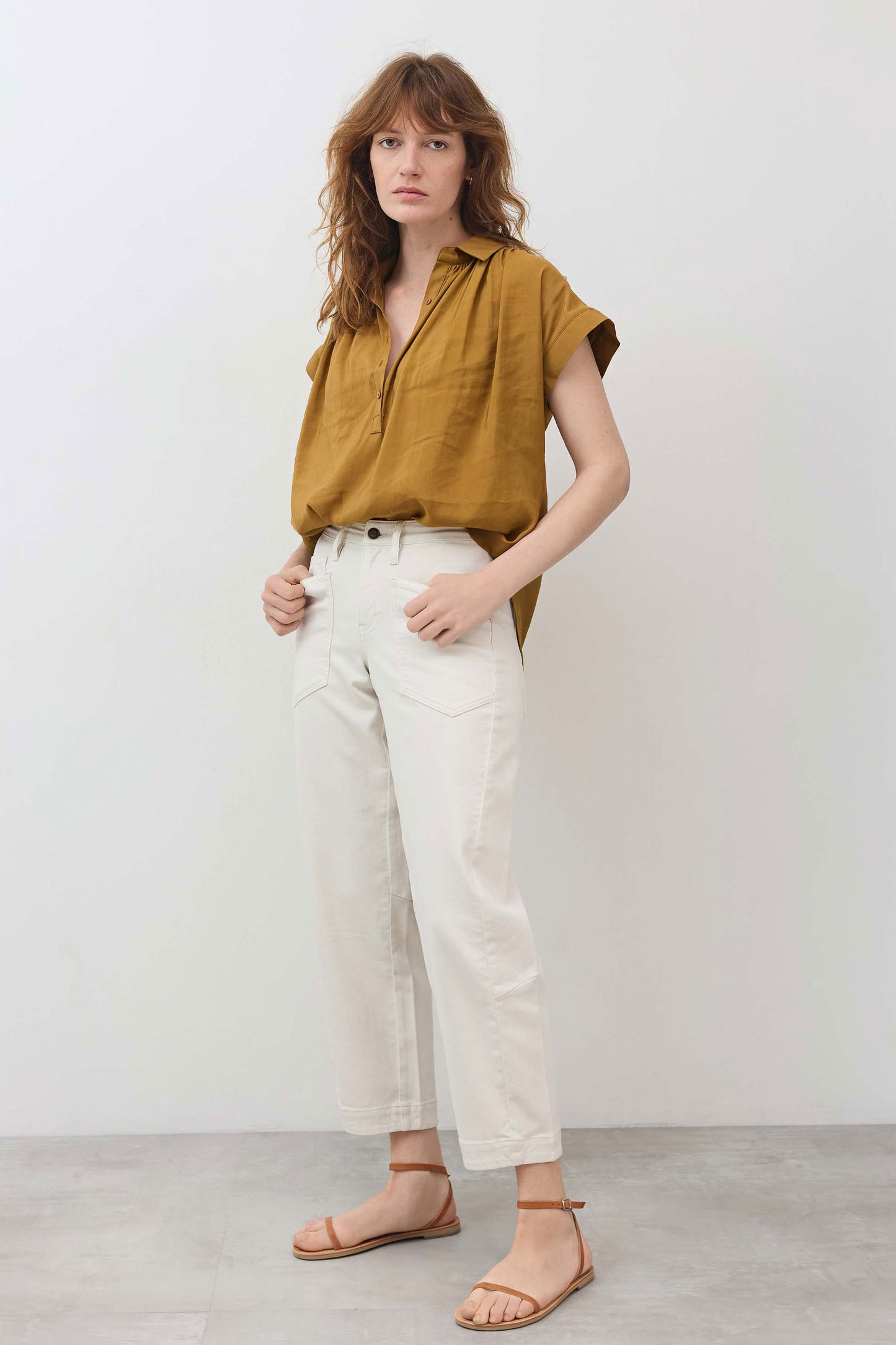 Oversized honey-gold blouse with short sleeves and half-button placket