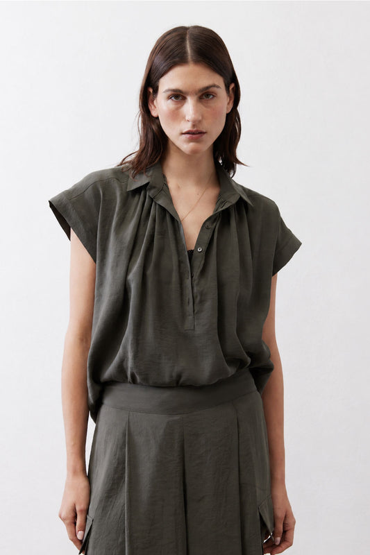 Oversized voile blouse in dark green with short sleeves, collar, and button placket