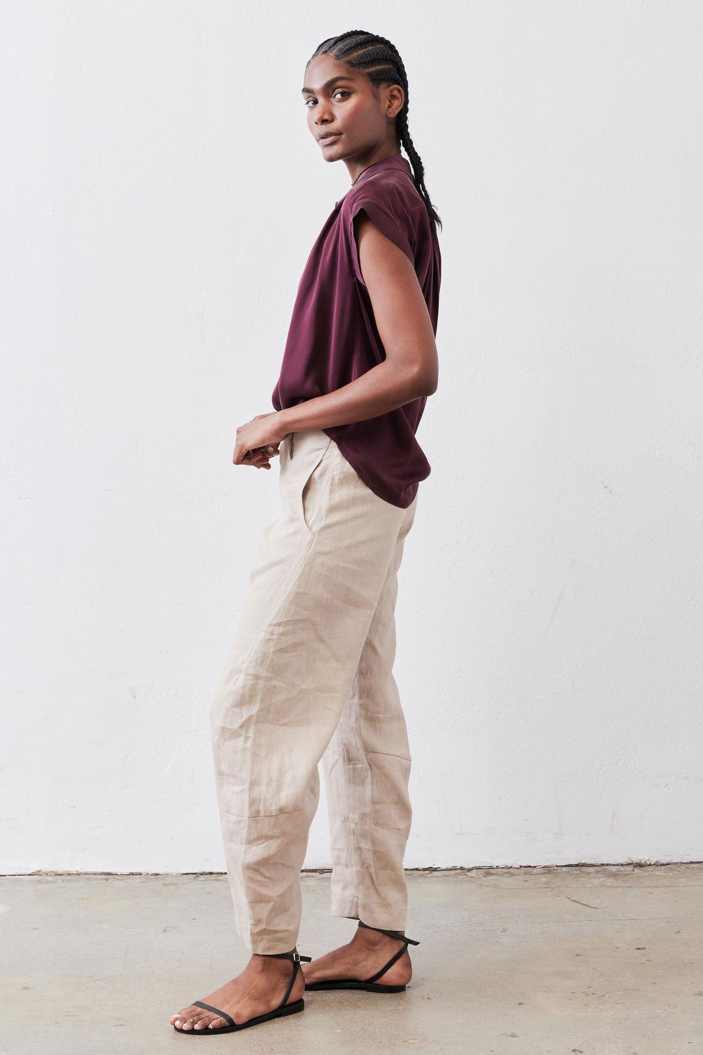 Malbec silk blouse in side profile: short sleeves, button-front, loose fit