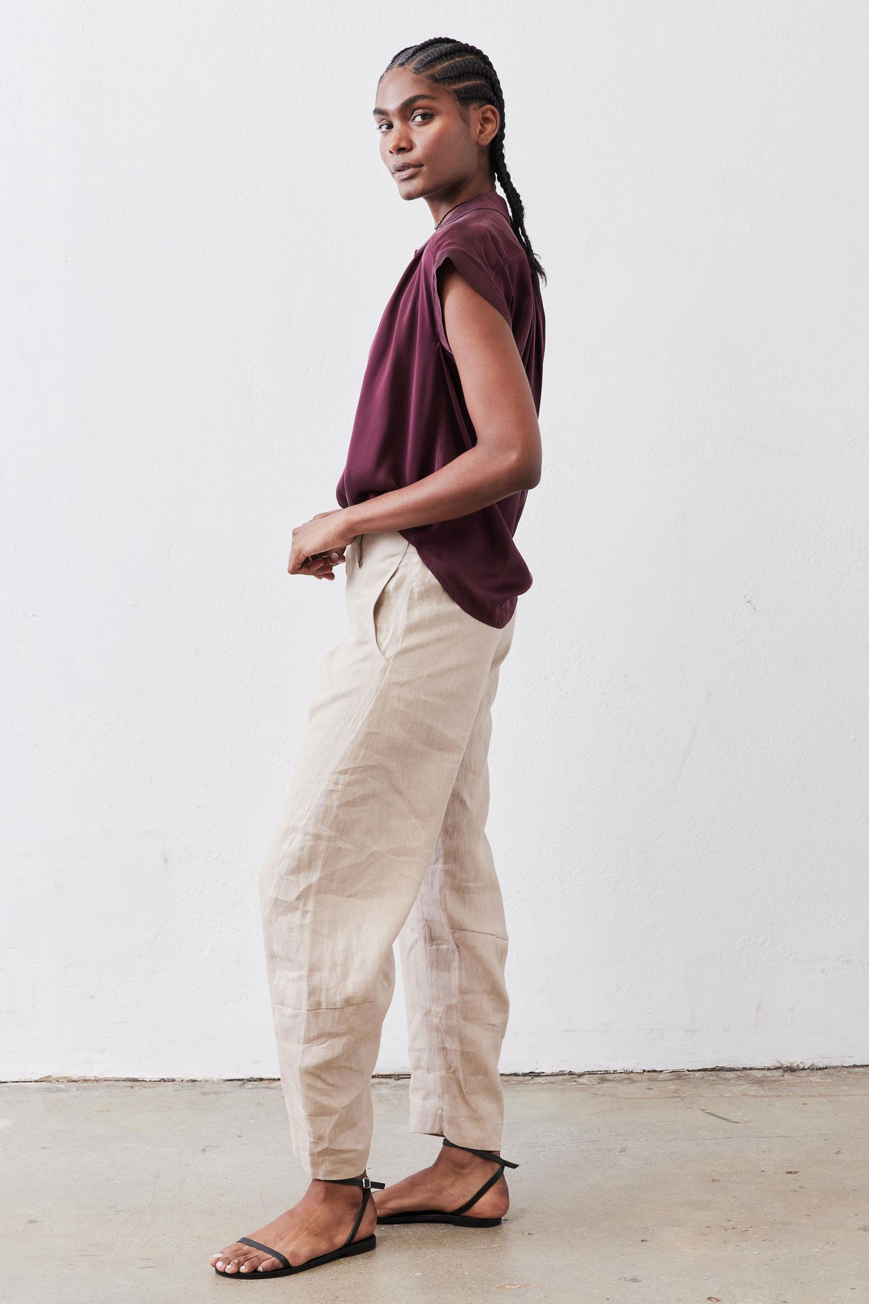 Malbec silk blouse in side profile: short sleeves, button-front, loose fit