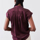 Malbec silk blouse back view with gathered yoke and draped shoulders