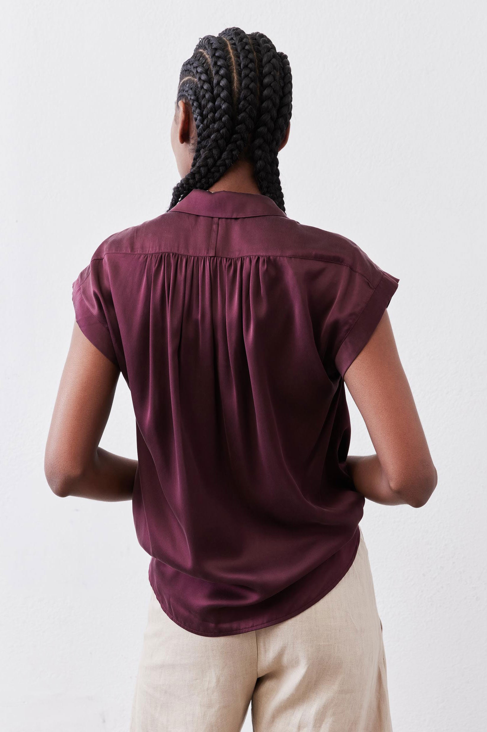 Malbec silk blouse back view with gathered yoke and draped shoulders