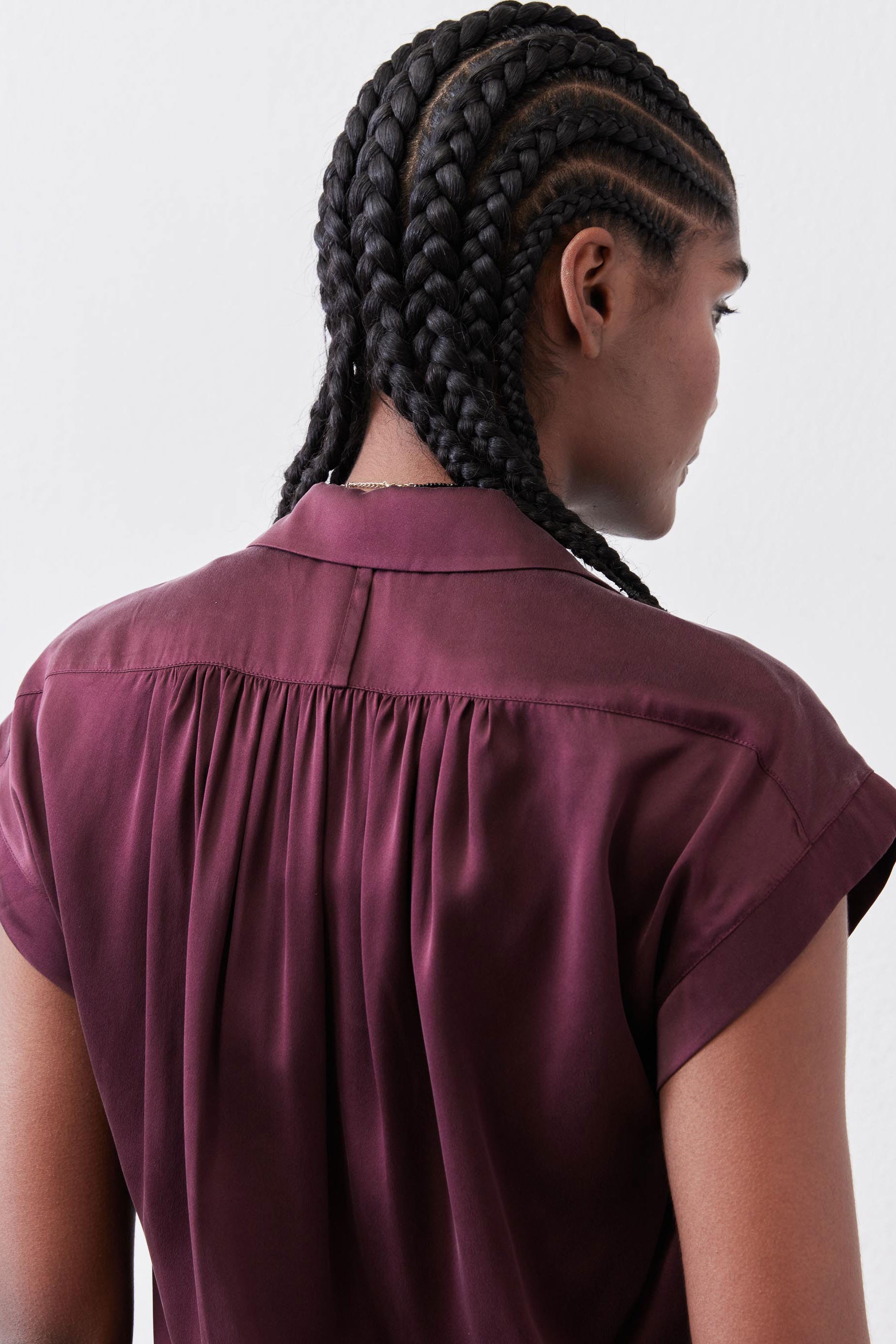 Malbec silk blouse back view with gathered yoke and short flutter sleeves