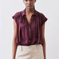Malbec oversized silk blouse with short sleeves, button-front, and relaxed silhouette