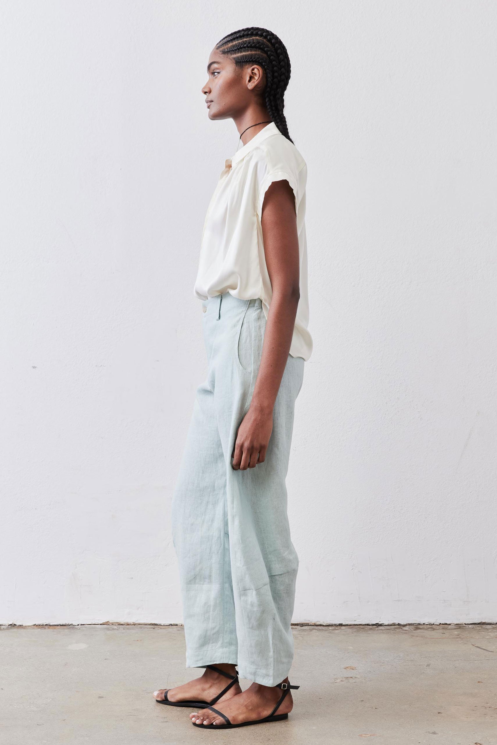 Ivory oversized silk blouse with pleated front and short sleeves