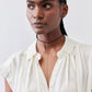 Ivory silk blouse with open V-neck and short button front