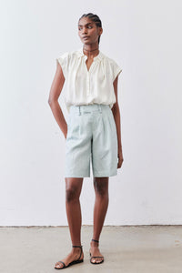 Mint pleated bermuda shorts with relaxed fit and cuffed hem