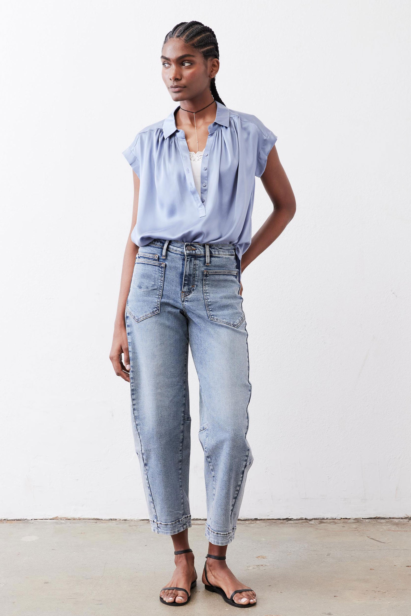 Steel blue silk blouse with short sleeves and relaxed fit, front view.