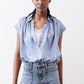 Steel blue silk blouse, short sleeves, button placket, relaxed collar.