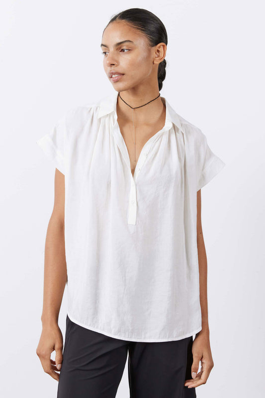 White oversized voile blouse with short sleeves and relaxed draped front