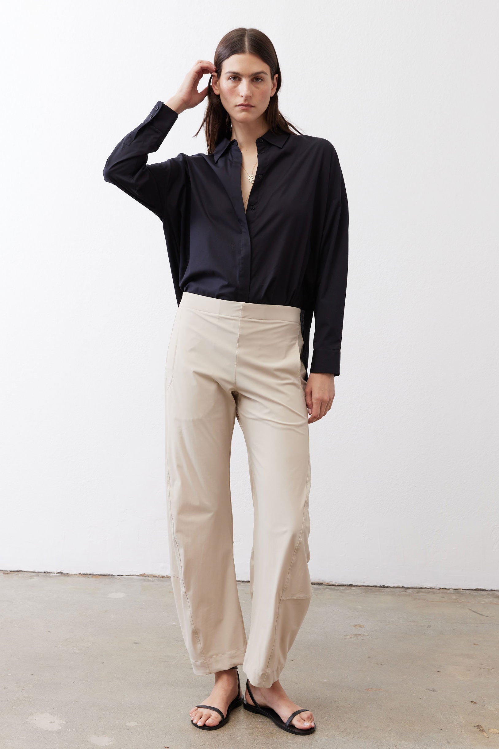 Black oversized tunic with point collar and button-front, long sleeves