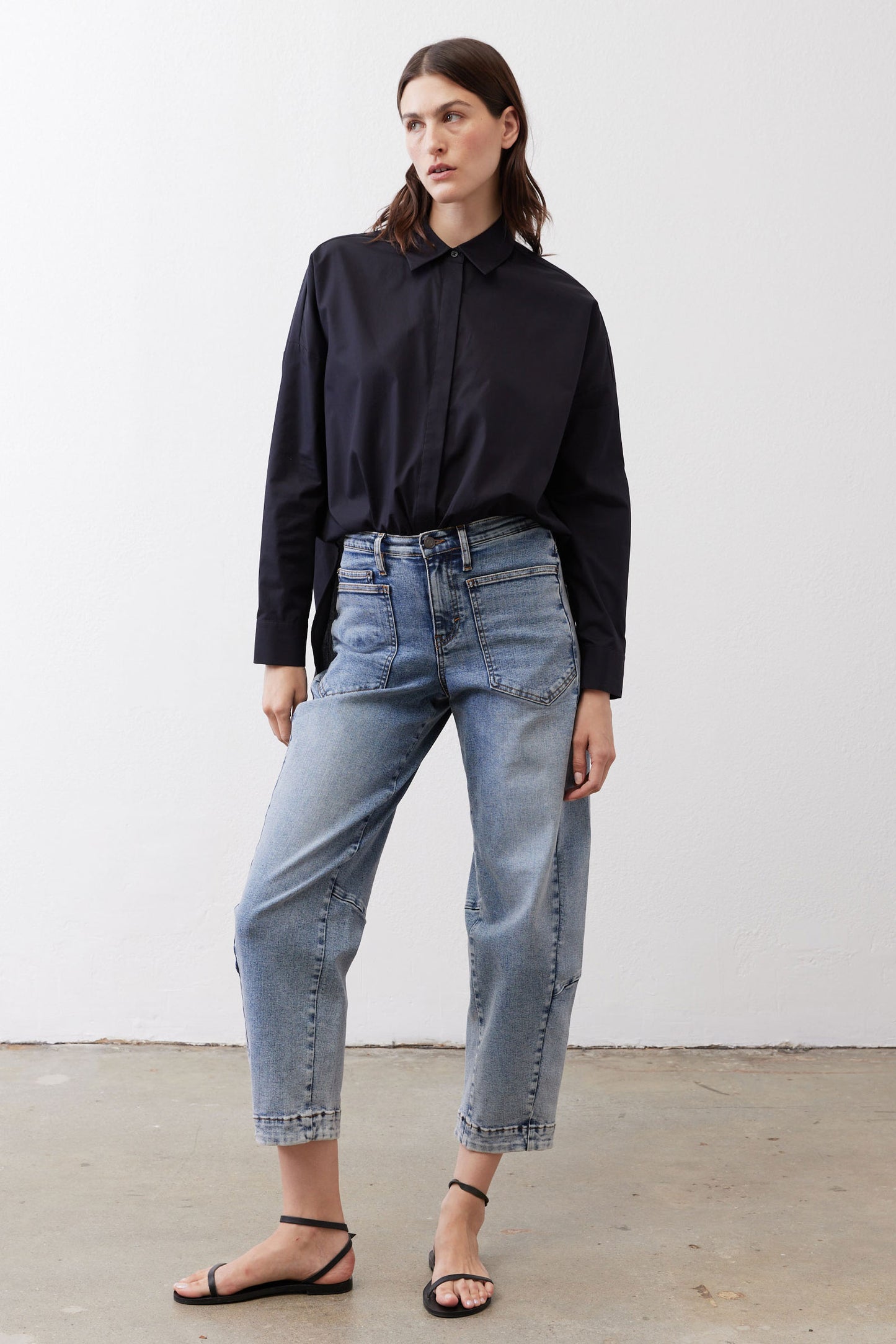 Black oversized tunic with point collar and button-front, long sleeves