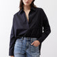 Black oversized tunic with open V neckline and button placket, long sleeves