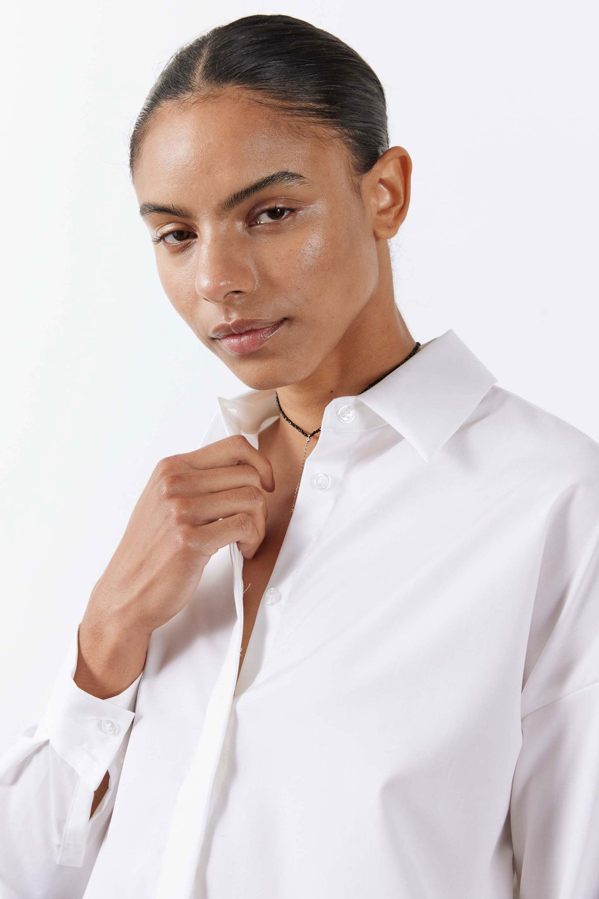White oversized tunic shirt collar with buttoned neckline, long sleeves
