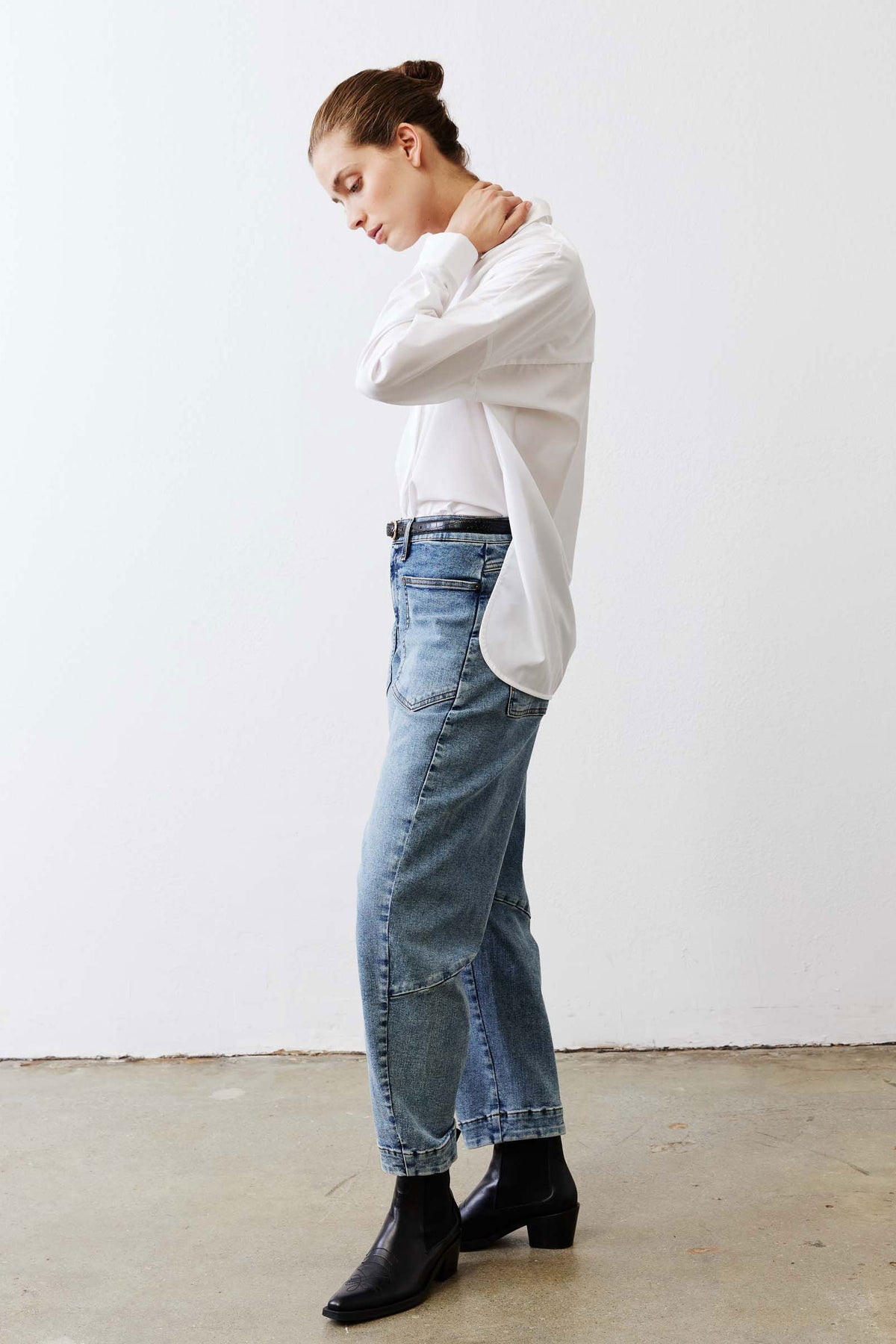 White oversized tunic shirt with point collar, button front, and long sleeves