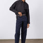Black oversized tunic shirt with button-front, pointed collar; long sleeves