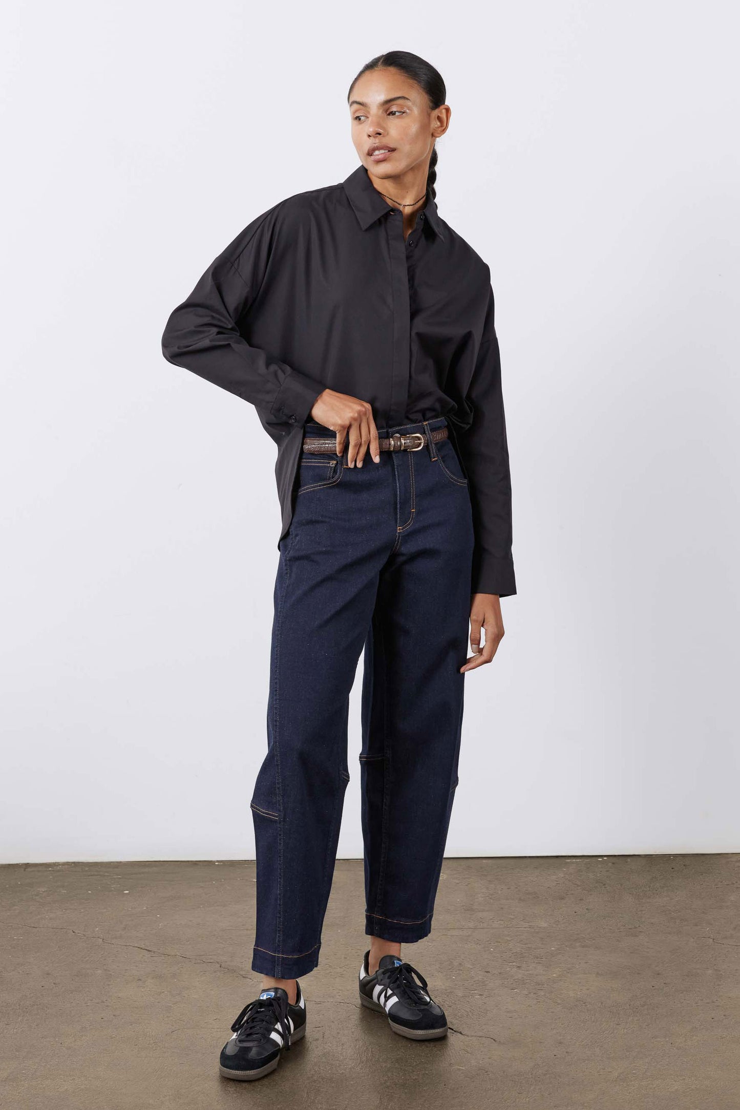 Black oversized tunic shirt with button-front, pointed collar; long sleeves