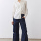 Petite dark-wash denim cargo pants with patch pockets and wide straight-leg fit