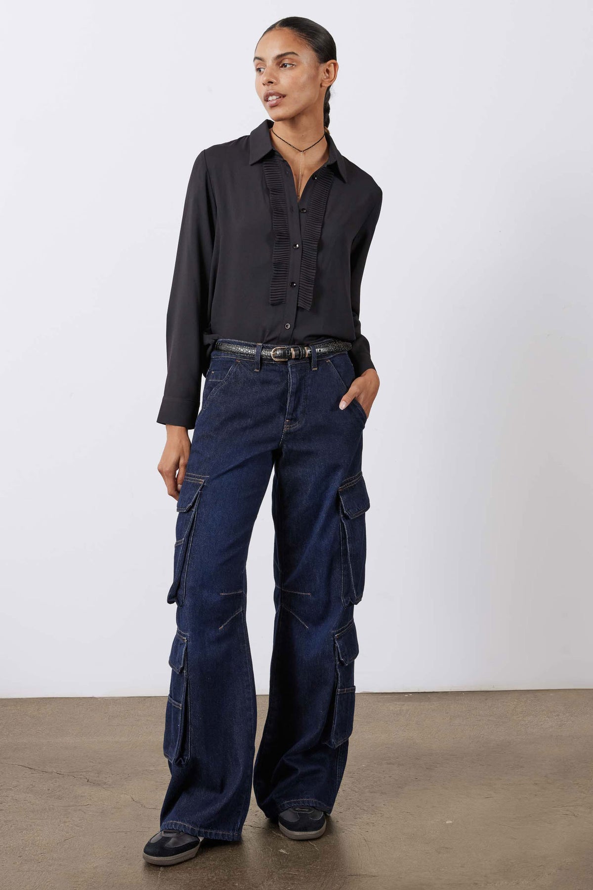Dark wash cargo jeans with multiple flap cargo pockets and wide straight leg opening
