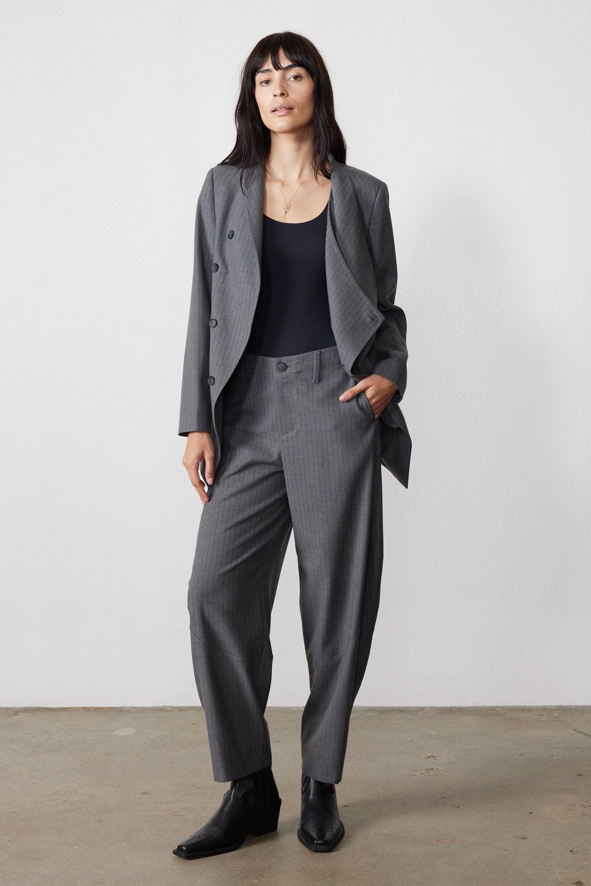 Gray pinstripe asymmetric suit jacket with notch lapel and double-breasted buttons
