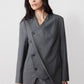 Gray pinstripe asymmetric suit jacket with double-breasted buttons and draped hem