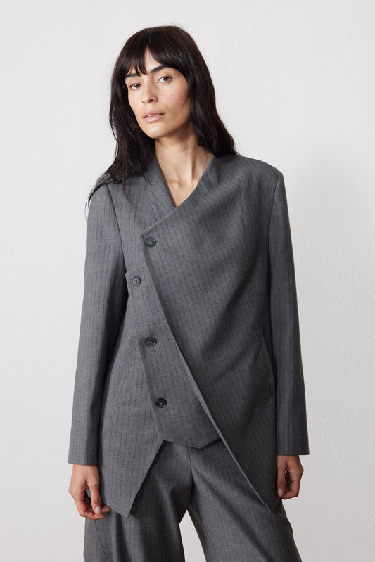 Gray pinstripe asymmetric suit jacket with double-breasted buttons and draped hem