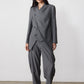 Gray pinstripe asymmetric suit jacket with angled front opening and long sleeves