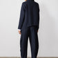 Navy pinstripe asymmetric suit jacket, back view, long sleeves and split hem