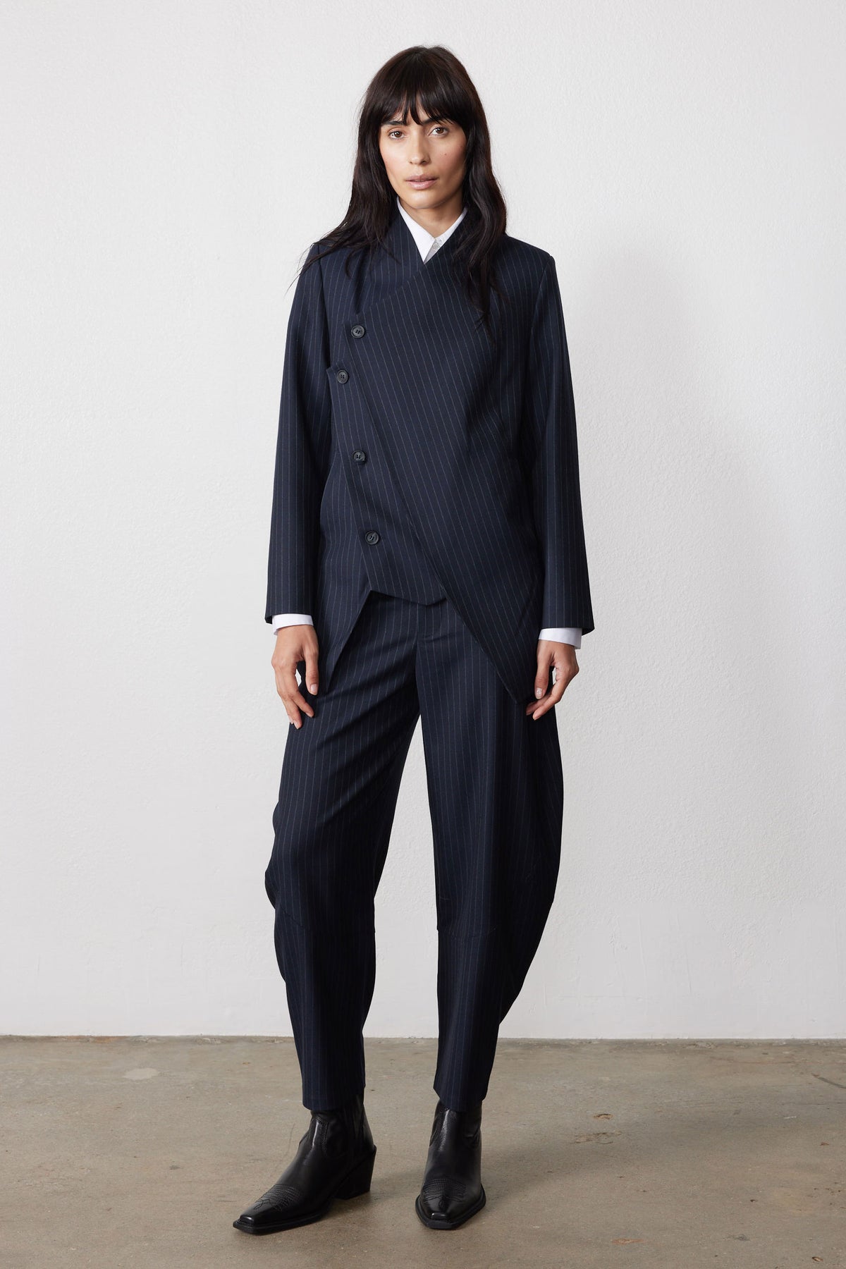 Navy pinstripe asymmetric suit jacket, button-front, long sleeves and notched lapel