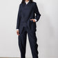 Navy pinstripe asymmetric suit jacket, front view, two-button closure and long sleeves