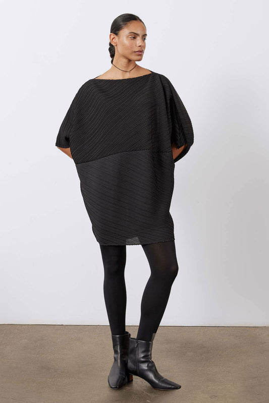 Black pleated tunic with draped asymmetric hem and elbow-length sleeves