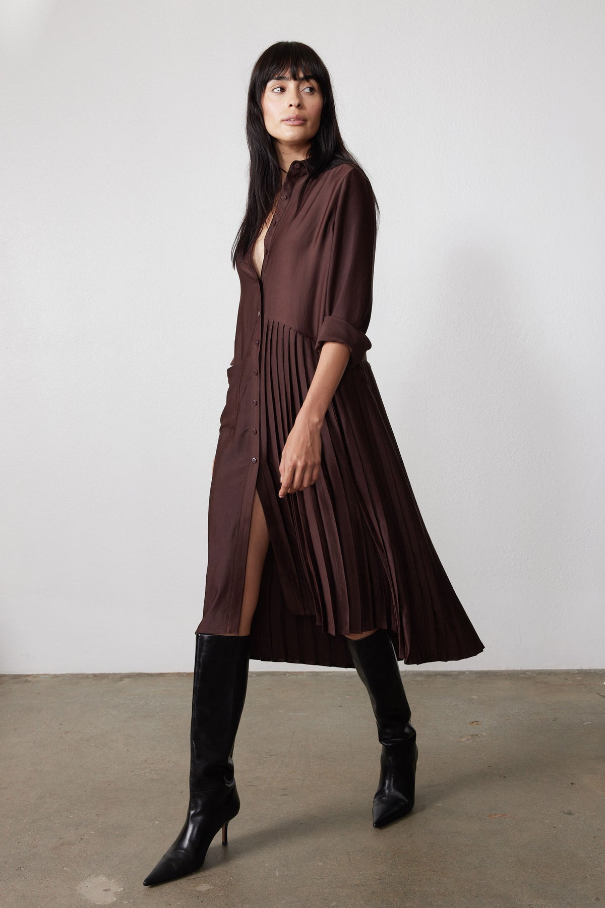 Coffee bean brown long-sleeve button dress with asymmetrical pleated skirt and side slit