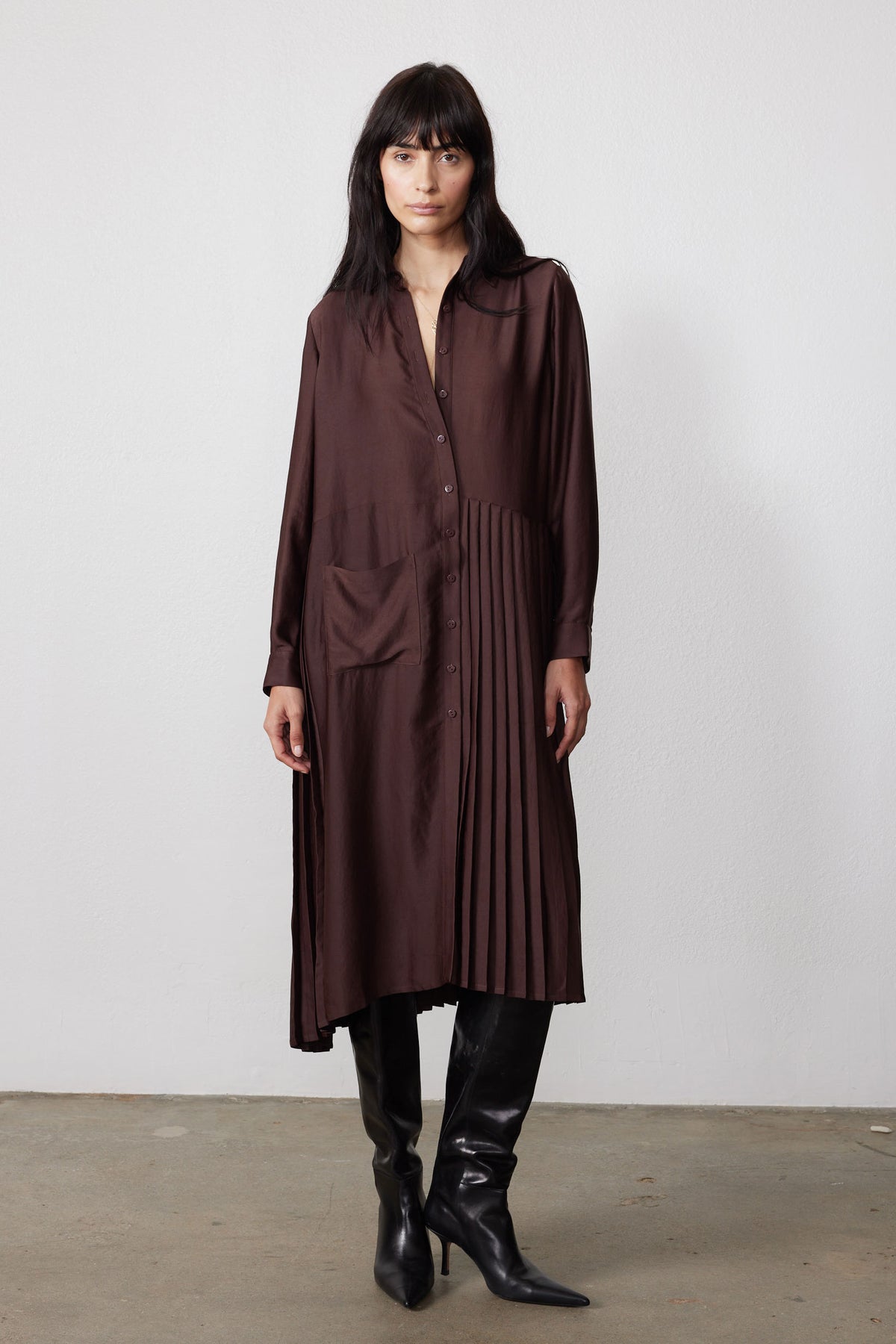 Dark brown long-sleeve button dress with asymmetrical pleated skirt overlay